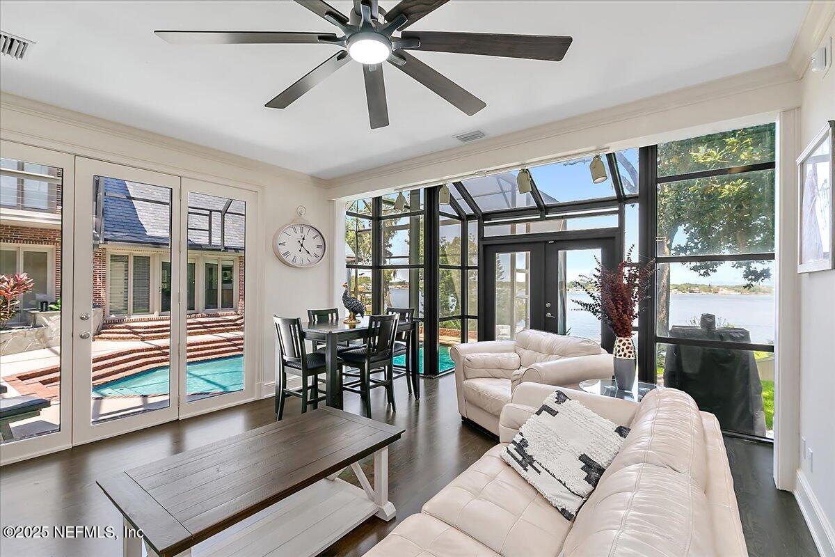 12827 Fort Caroline Road Jacksonville, FL 32225 - Photo 19 of 42 a living room with furniture and large windows