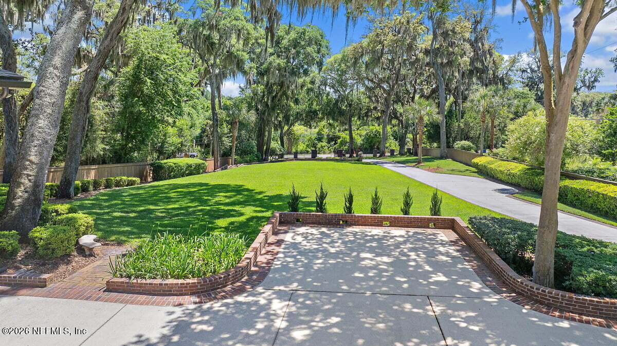 12827 Fort Caroline Road Jacksonville, FL 32225 - Photo 2 of 42 a view of a pathway with a yard