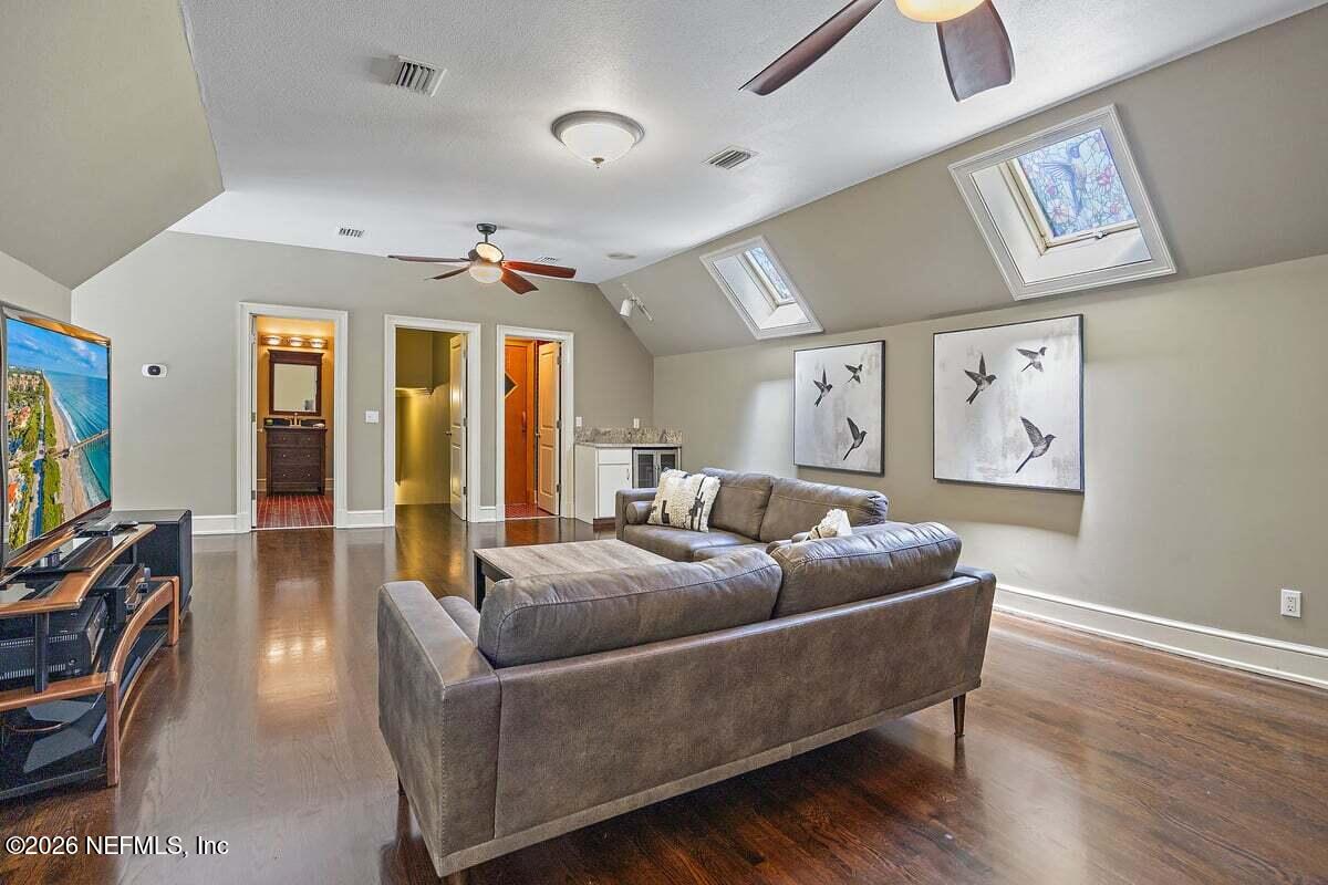 12827 Fort Caroline Road Jacksonville, FL 32225 - Photo 24 of 42 a living room with furniture and a flat screen tv
