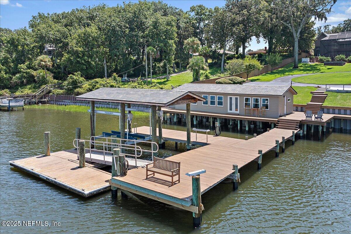 12827 Fort Caroline Road Jacksonville, FL 32225 - Photo 32 of 42 a view of a house with pool and chairs