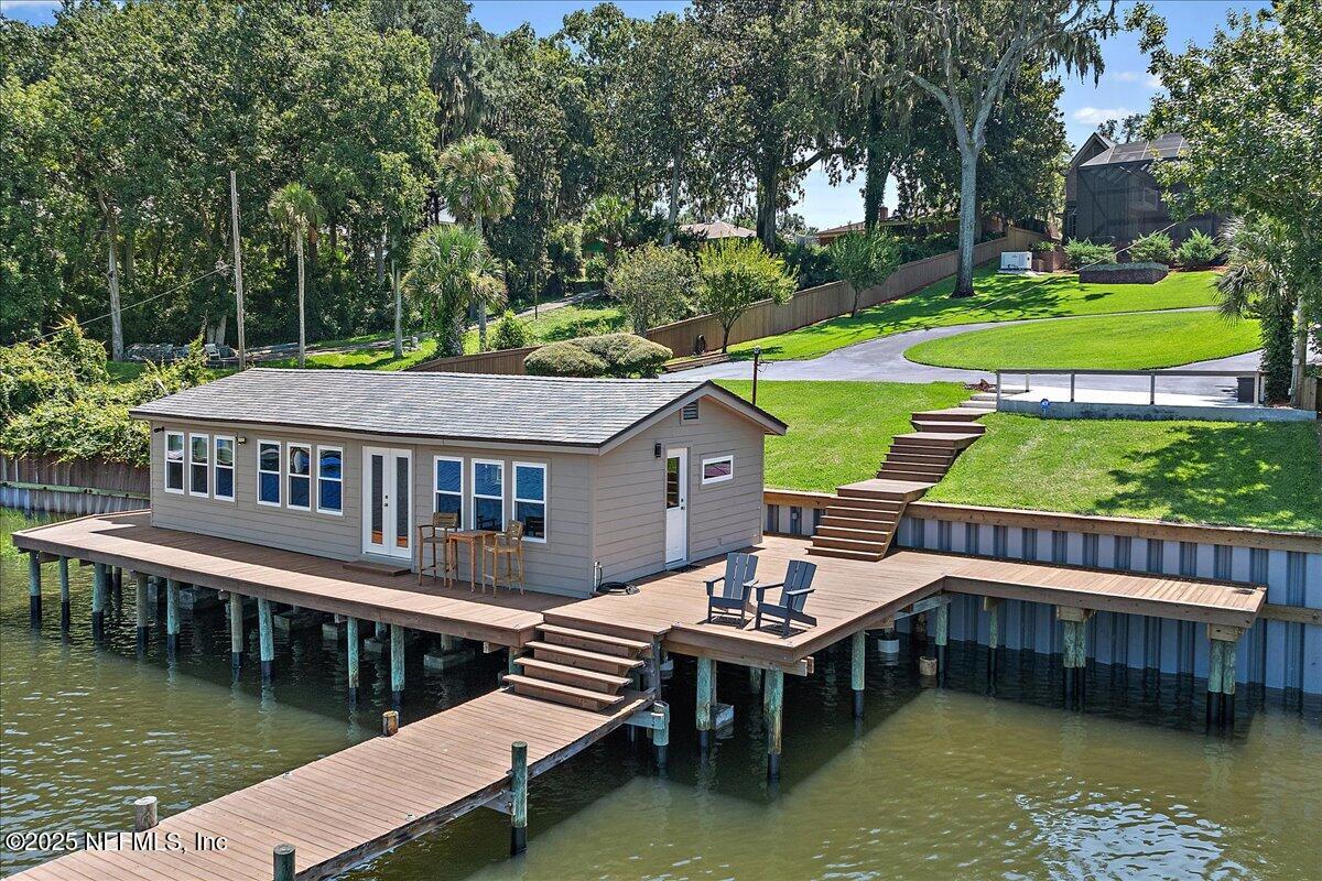 12827 Fort Caroline Road Jacksonville, FL 32225 - Photo 33 of 42 a view of a house with pool and wooden deck