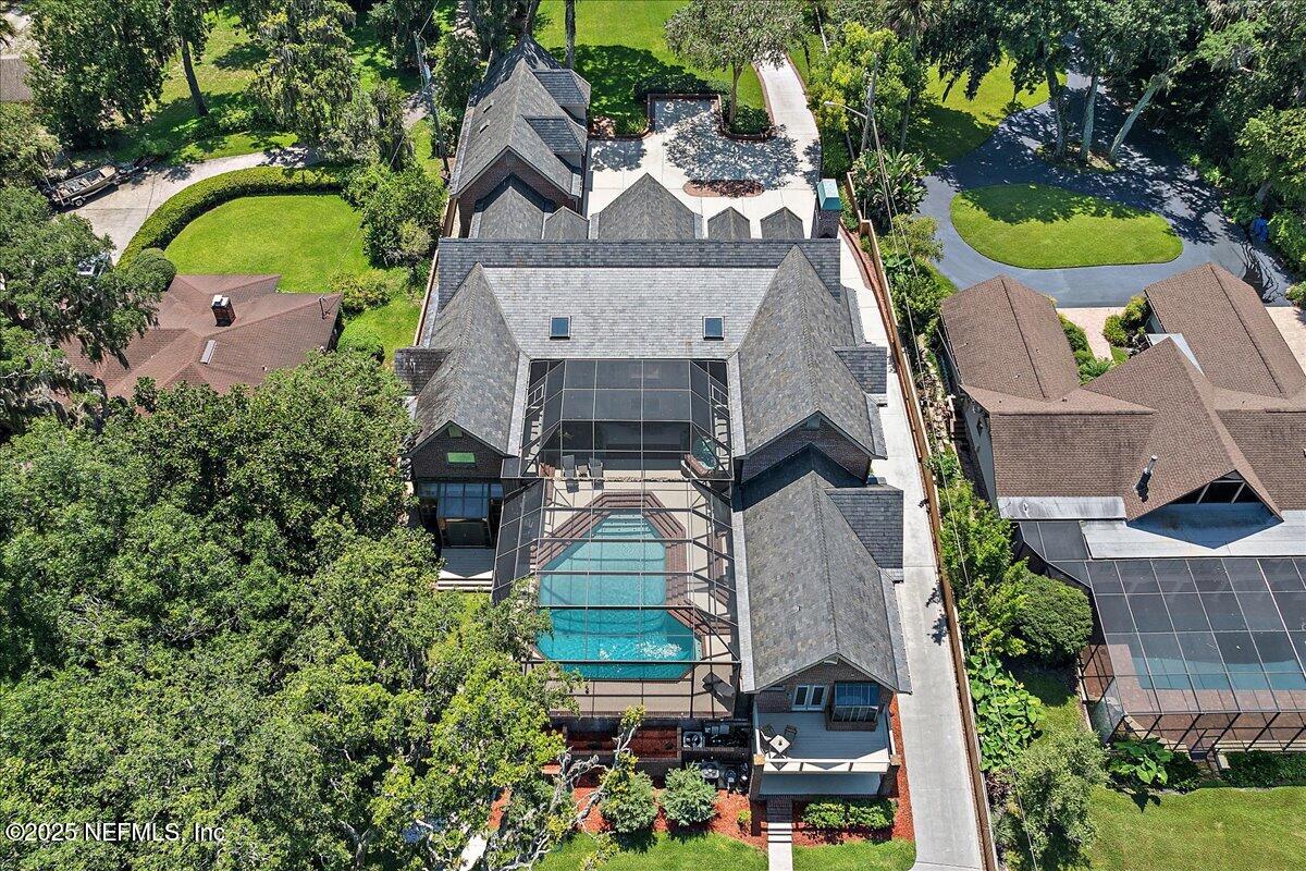 12827 Fort Caroline Road Jacksonville, FL 32225 - Photo 38 of 42 an aerial view of a house with a garden and swimming pool