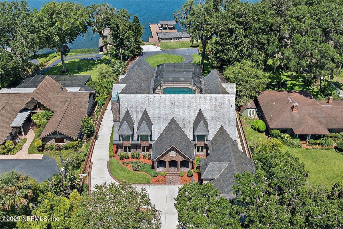 12827 Fort Caroline Road Jacksonville, FL 32225 - Photo 10 of 42 an aerial view of a house with swimming pool and garden