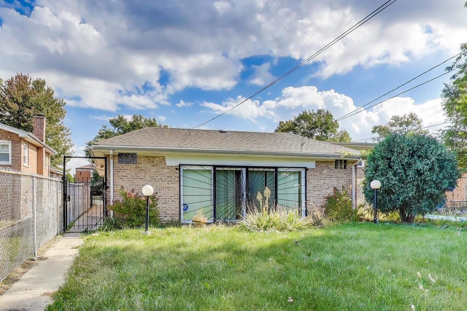 8622 South Michigan Avenue Chicago, IL 60619 - Photo 18 of 20 a view of a house with yard and a garden