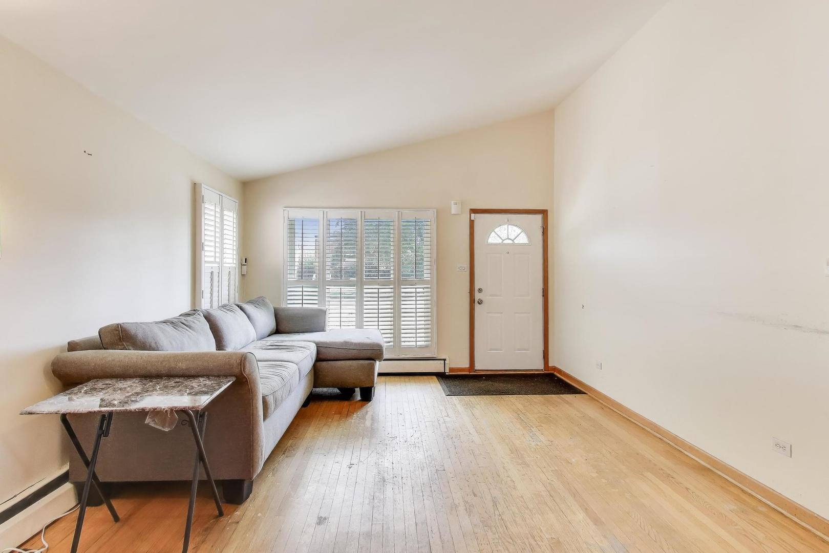 8622 South Michigan Avenue Chicago, IL 60619 - Photo 4 of 20 a living room with furniture and a window