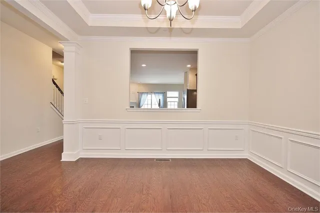 a kitchen with a refrigerator and a stove top oven