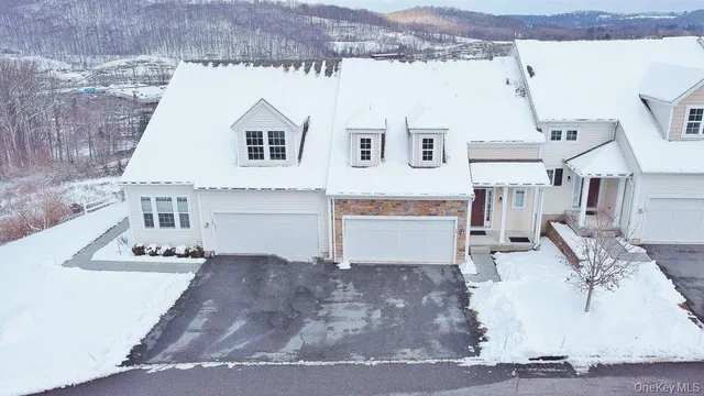 a view of living room kitchen with stainless steel appliances