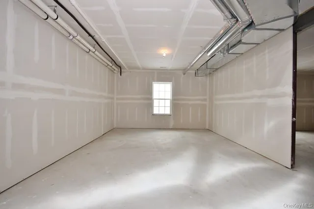 a living room with furniture a fireplace and a chandelier