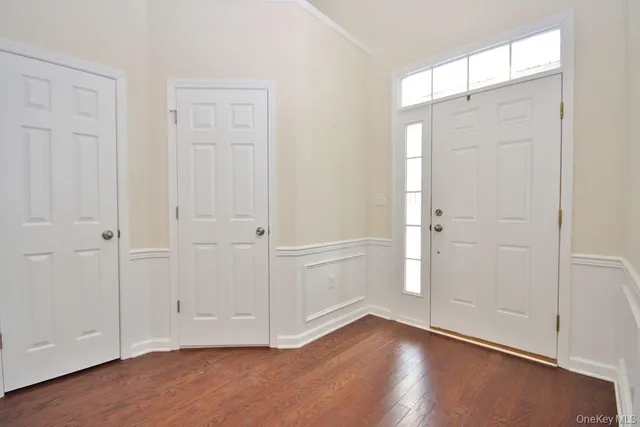 a bathroom with a toilet a sink and a mirror