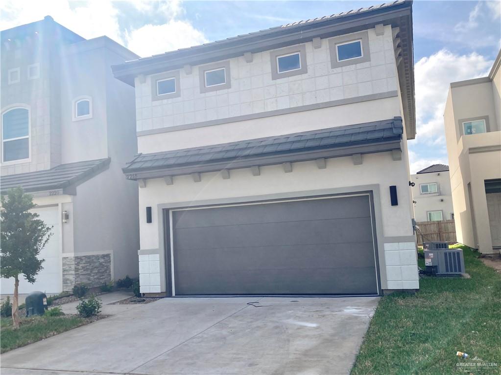 a front view of a house with a garage