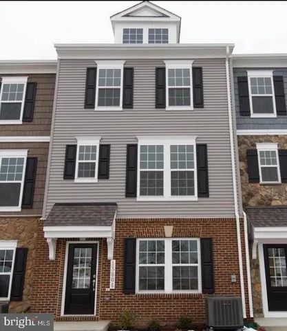 a front view of a building with windows