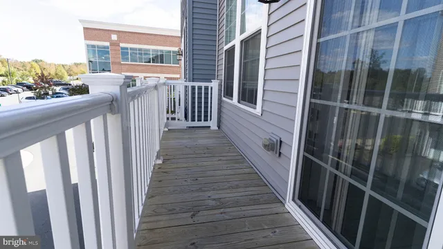 a view of a balcony with wooden floor