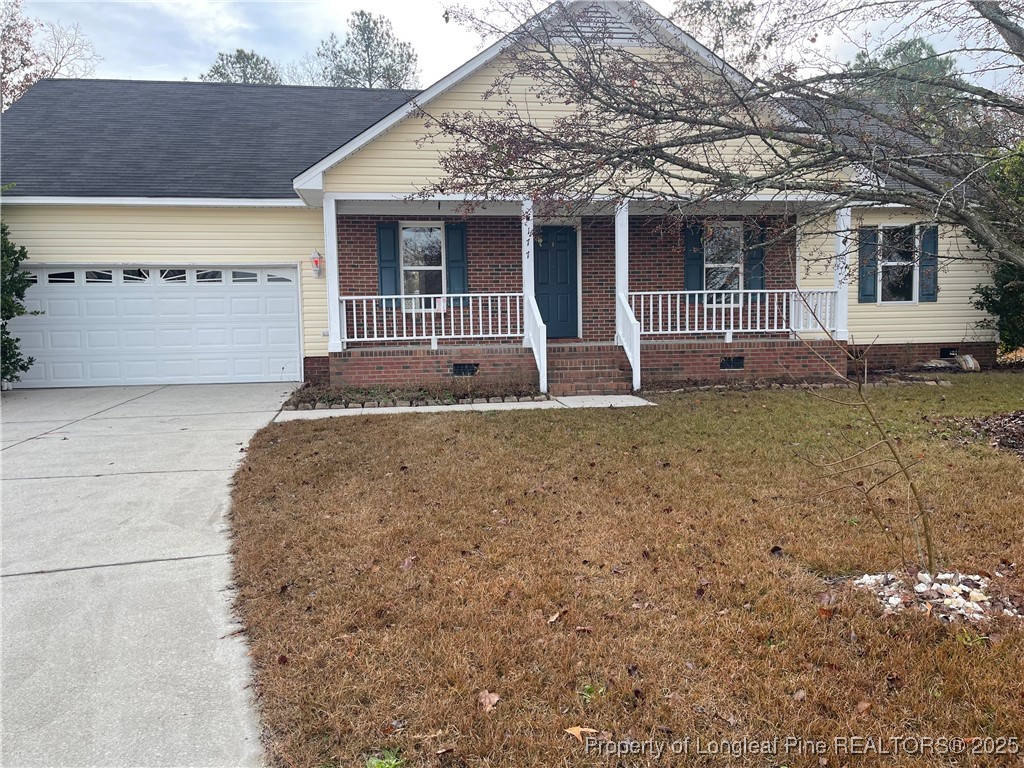 a house that has a tree in front of it