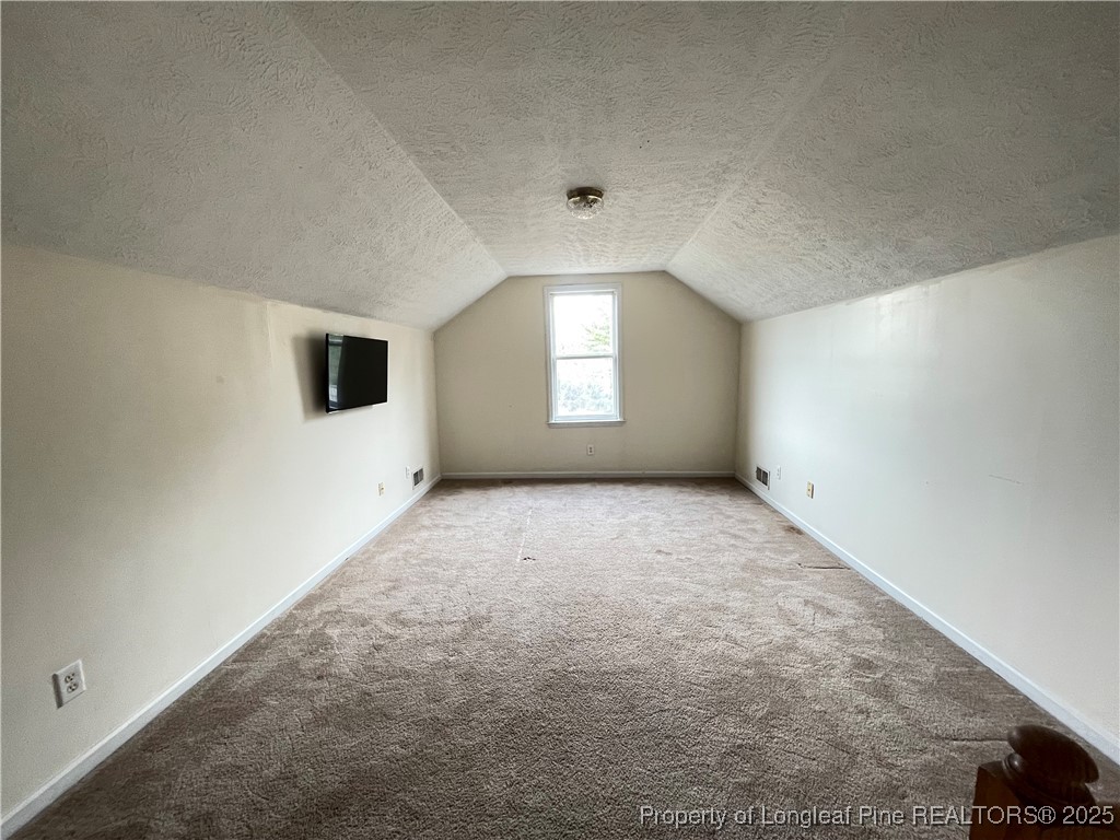177 Deep Creek Lane Raeford, NC 28376 - Photo 12 of 28 an empty room with a empty space and windows
