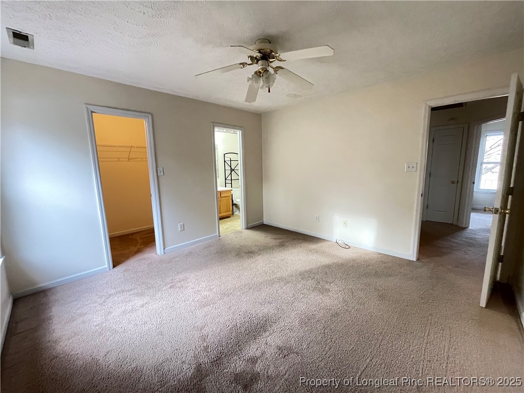177 Deep Creek Lane Raeford, NC 28376 - Photo 19 of 28 a view of a room with a ceiling fan and entryway