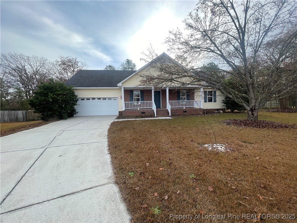 177 Deep Creek Lane Raeford, NC 28376 - Photo 2 of 28 a front view of a house with a garden