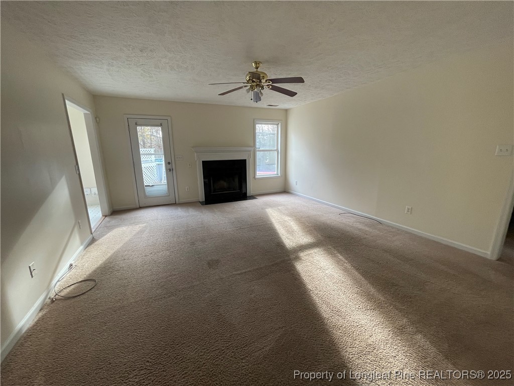 177 Deep Creek Lane Raeford, NC 28376 - Photo 7 of 28 a view of a livingroom with an empty space and a fireplace
