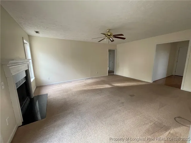 an empty room with a empty space and windows