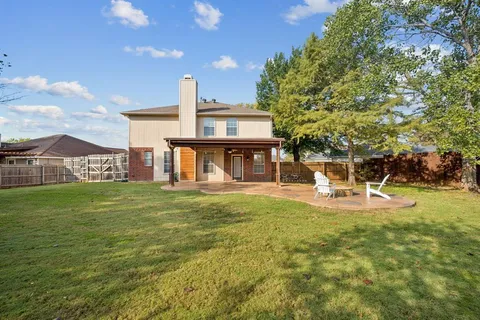 a view of a house with a yard porch and sitting area