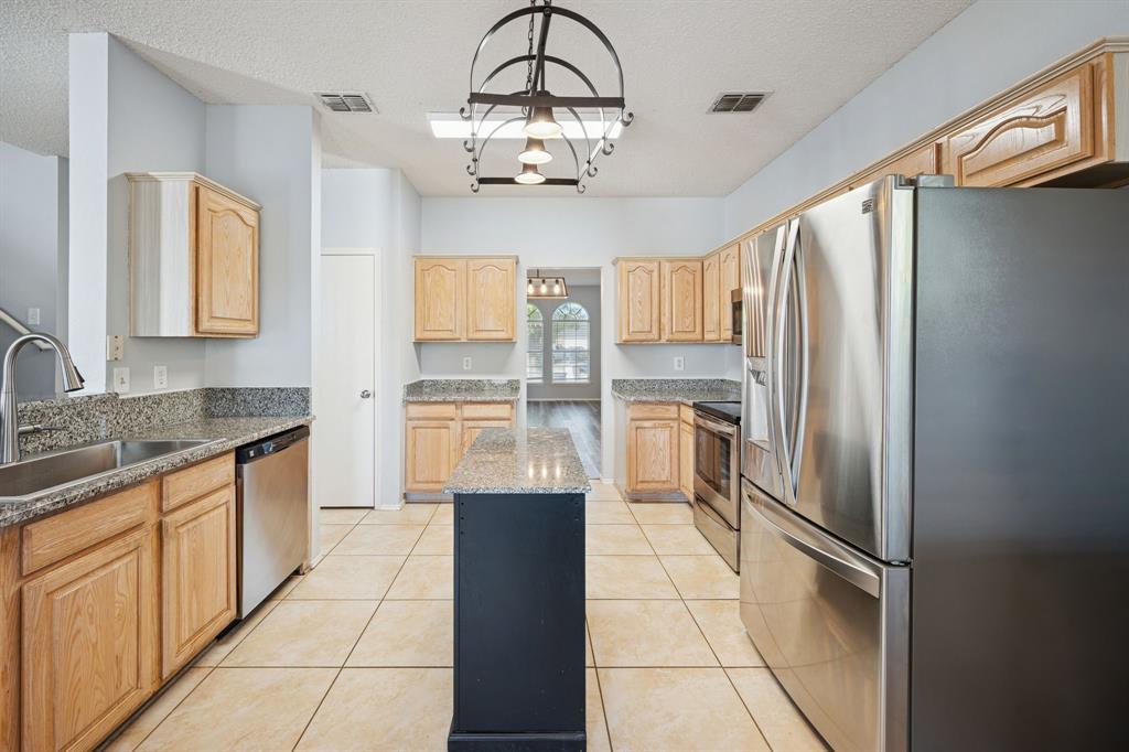 3304 Olympus Court Corinth, TX 76210 - Photo 14 of 40 Kitchen with ample cabinet space.