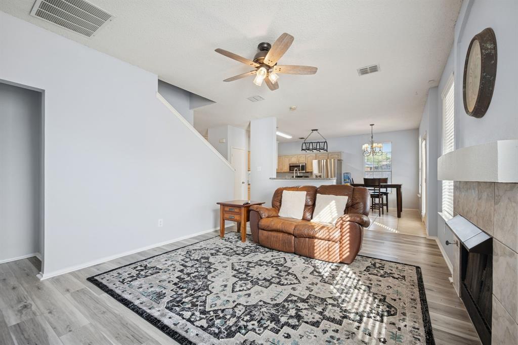 3304 Olympus Court Corinth, TX 76210 - Photo 18 of 40 a living room with furniture and a rug