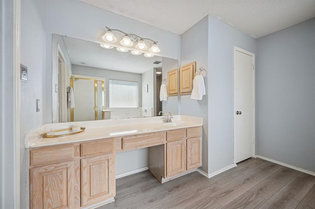 3304 Olympus Court Corinth, TX 76210 - Photo 26 of 40 a spacious bathroom with a double vanity sink mirror and