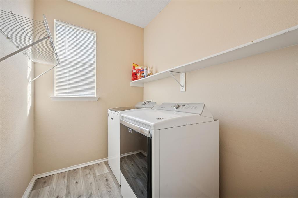 3304 Olympus Court Corinth, TX 76210 - Photo 35 of 40 a utility room with dryer and washer