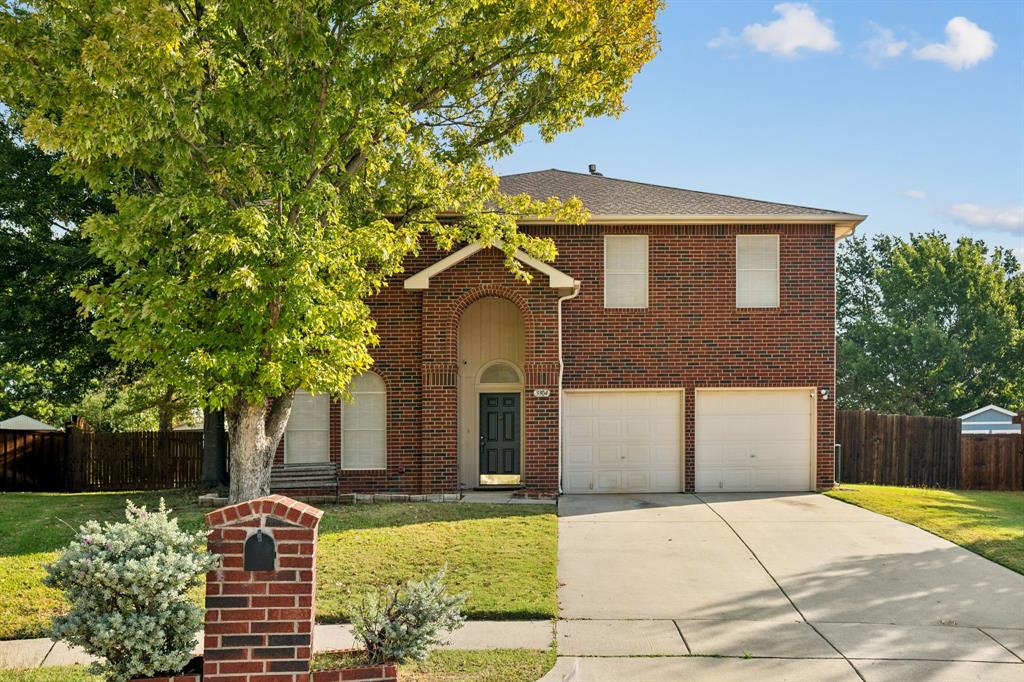 3304 Olympus Court Corinth, TX 76210 - Photo 37 of 40 a front view of a house with garden