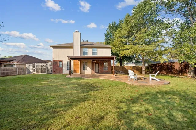 a view of a house with a yard porch and sitting area