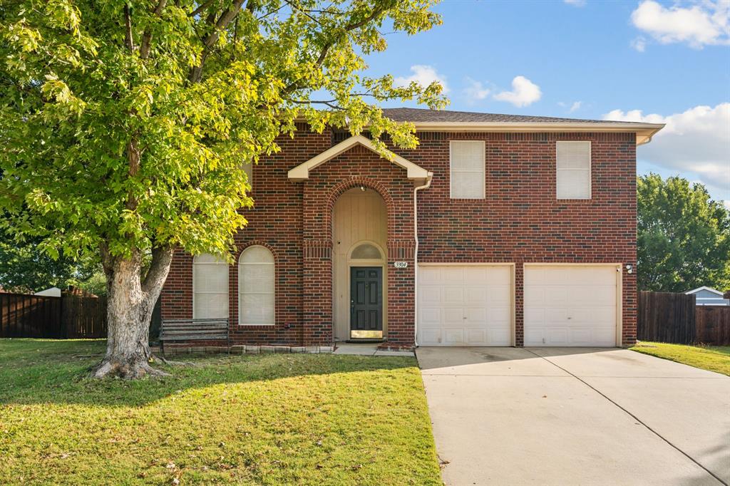 3304 Olympus Court Corinth, TX 76210 - Photo 10 of 40 a front view of a house with garden