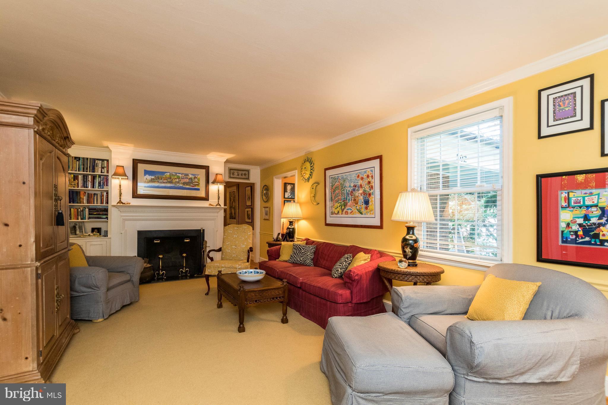 502 Worcester Road Towson, MD 21286 - Photo 2 of 30 a living room with furniture large window and fireplace