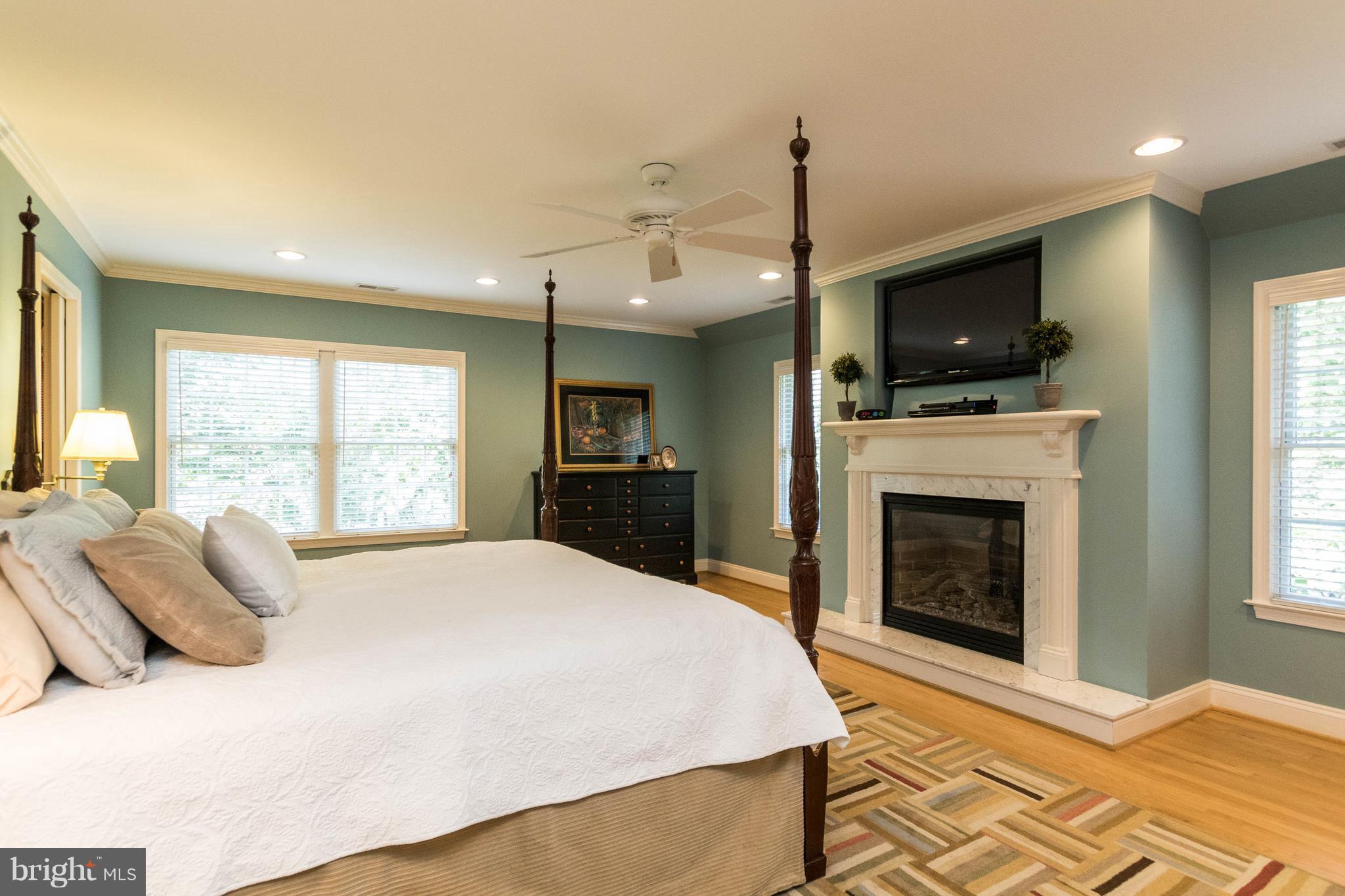 502 Worcester Road Towson, MD 21286 - Photo 11 of 30 a bedroom with a bed and a flat screen tv