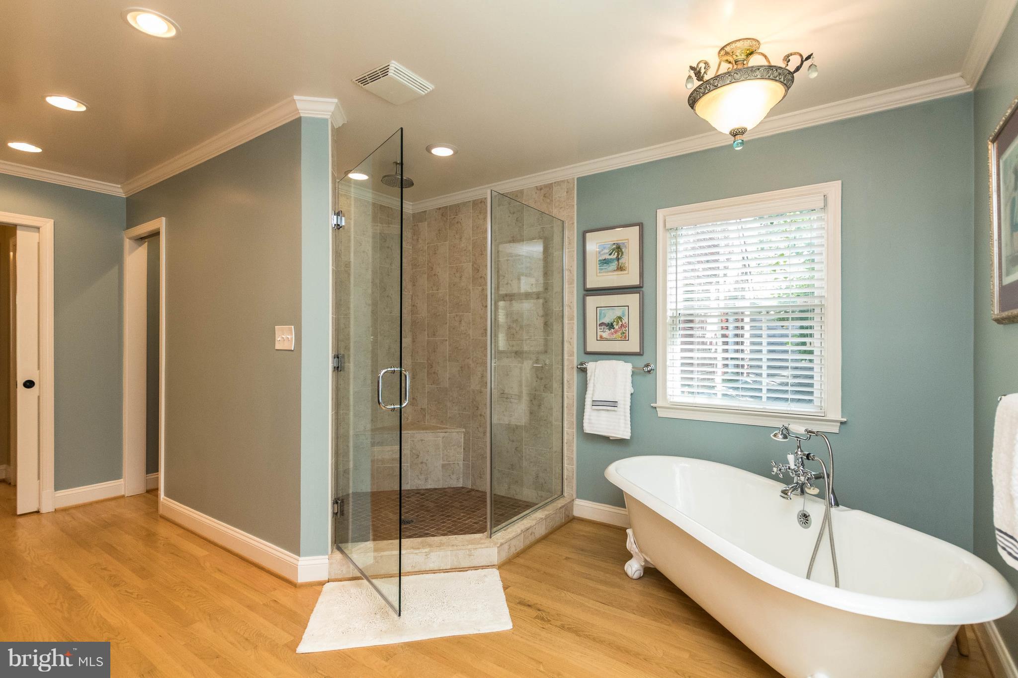 502 Worcester Road Towson, MD 21286 - Photo 14 of 30 a bathroom with a bathtub and a shower