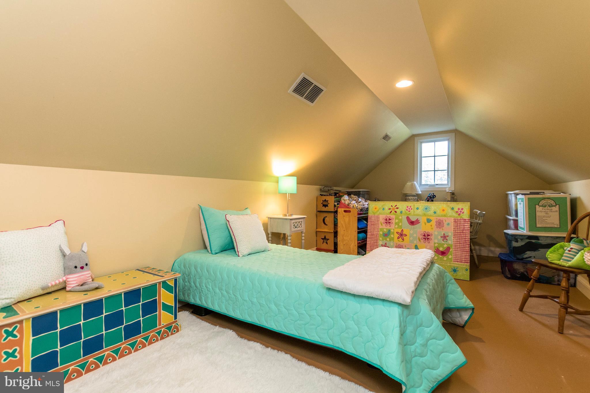 502 Worcester Road Towson, MD 21286 - Photo 23 of 30 a bedroom with a bed and a night stand
