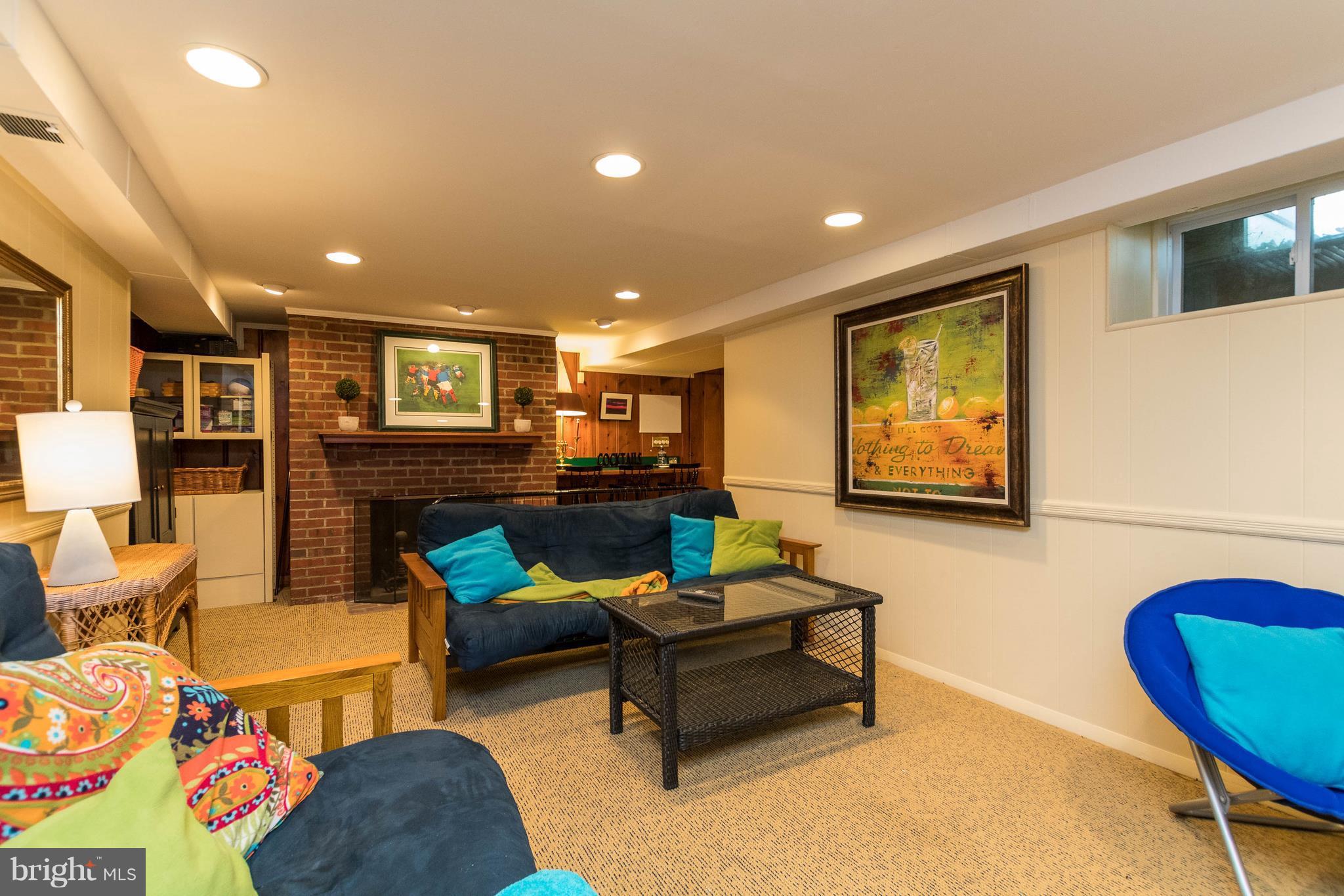502 Worcester Road Towson, MD 21286 - Photo 24 of 30 a living room with furniture and a flat screen tv