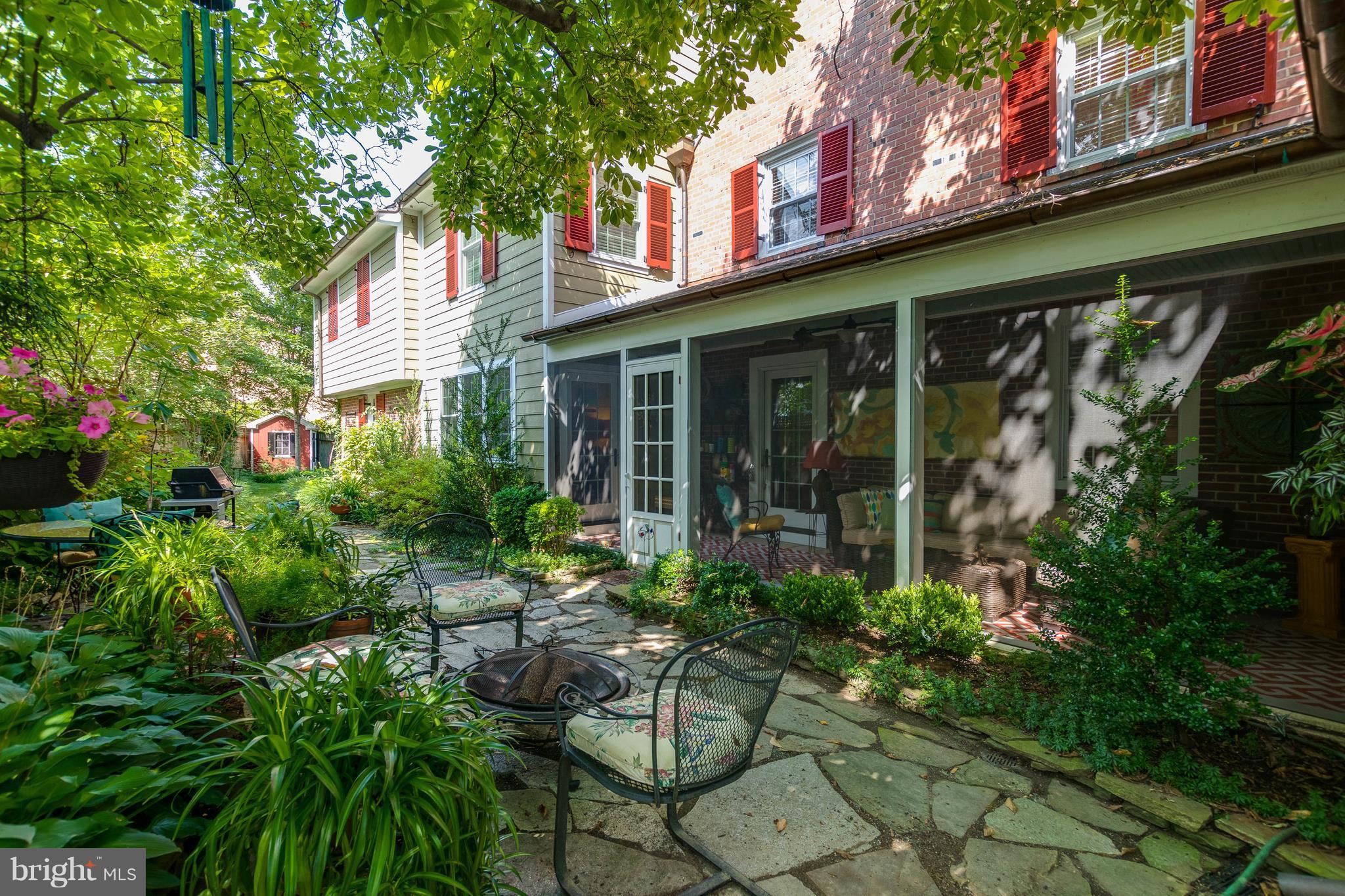 502 Worcester Road Towson, MD 21286 - Photo 28 of 30 a view of a house with potted plants and a bench