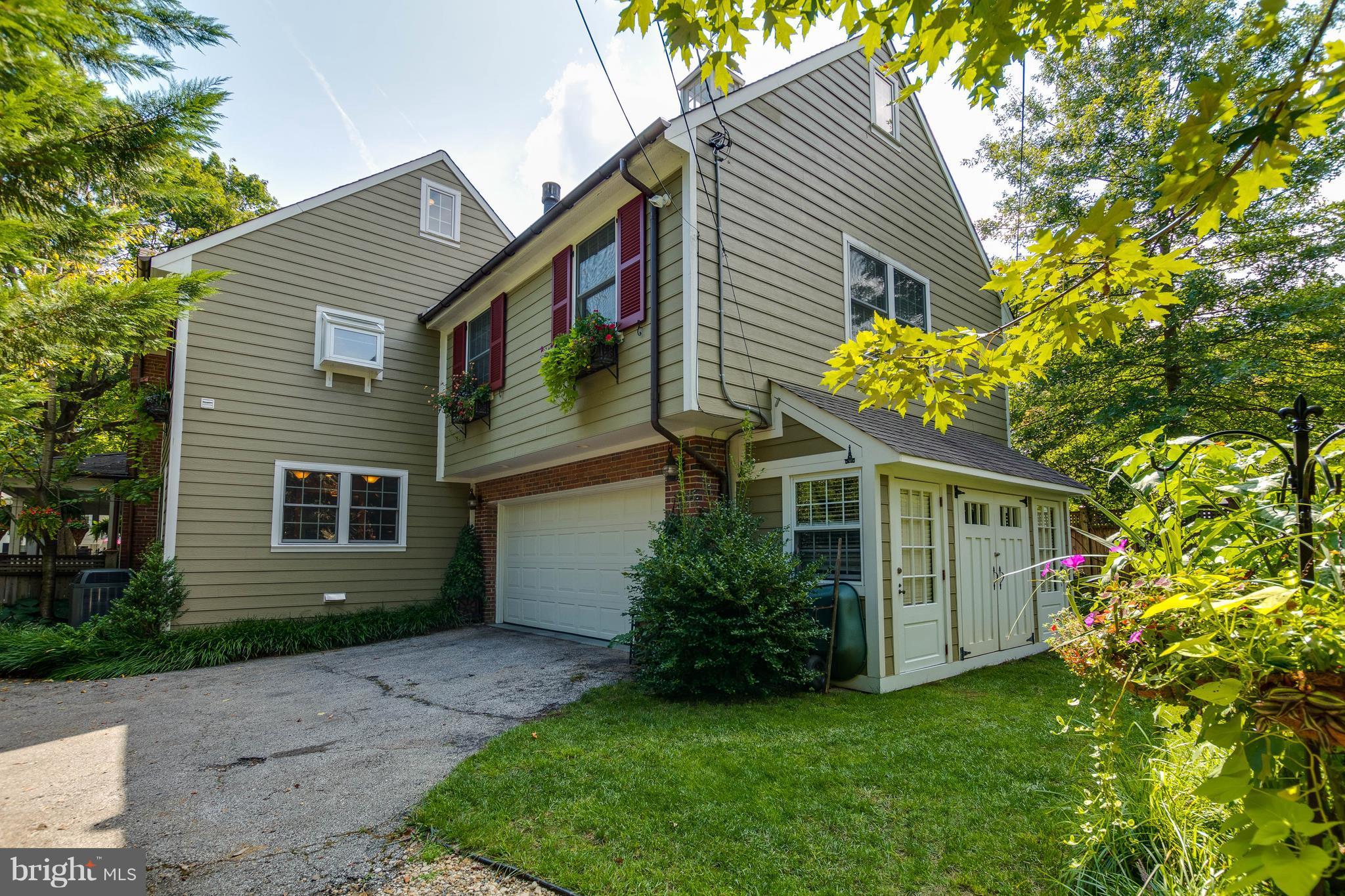 502 Worcester Road Towson, MD 21286 - Photo 29 of 30 a view of house with a yard and potted plants