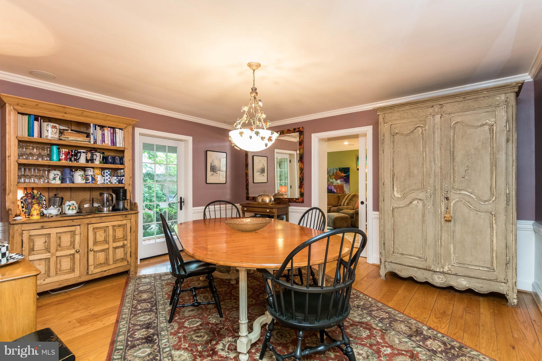 502 Worcester Road Towson, MD 21286 - Photo 4 of 30 a dining room with furniture a chandelier and wooden floor