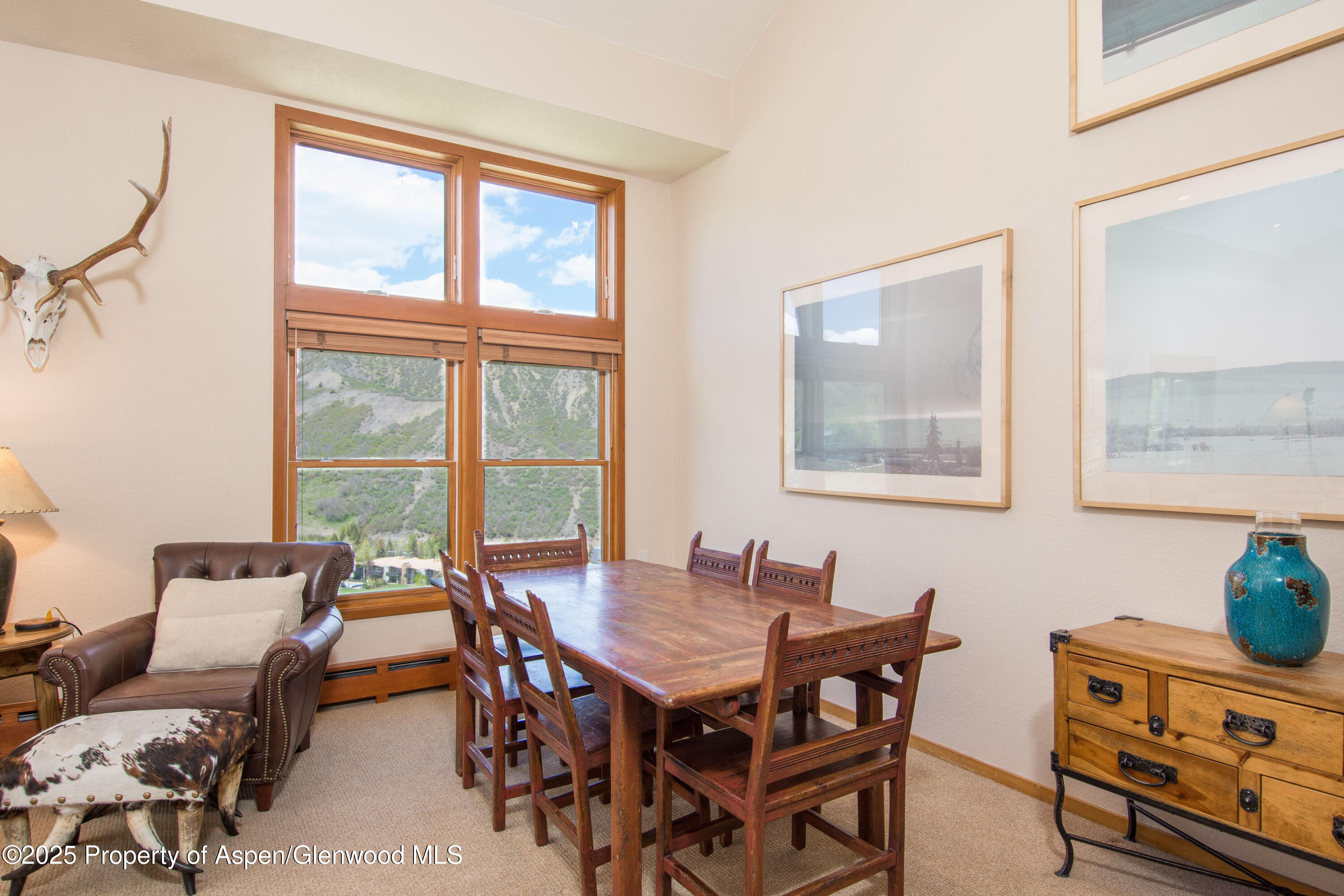 425 Wood Road, Unit 48 Snowmass Village, CO 81615 - Photo 8 of 41 a view of a dining room with furniture and window