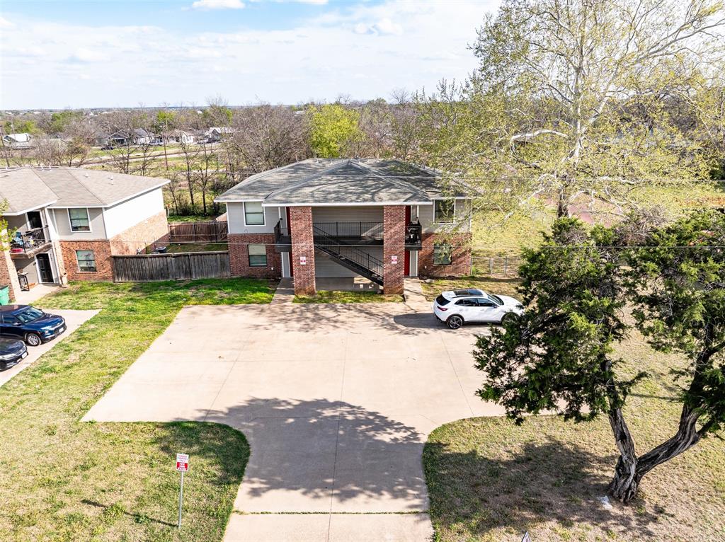 892 West Vanderbilt Street Stephenville, TX 76401 - Photo 4 of 34 a view of a house with a yard