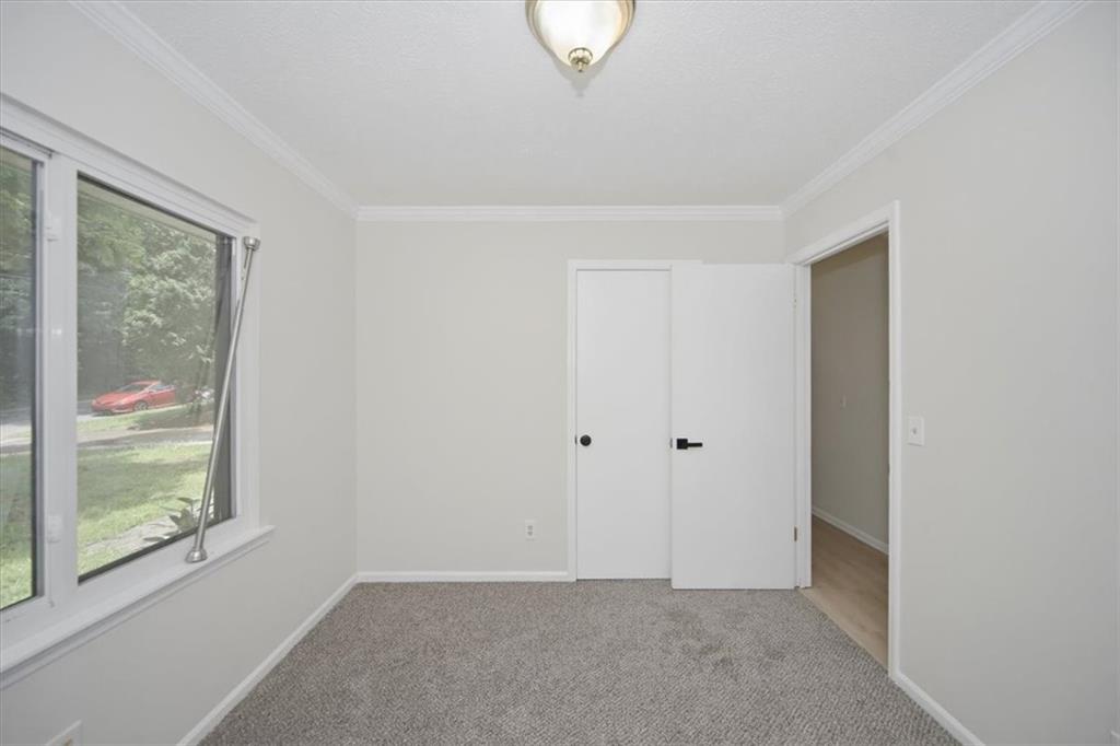 142 Deer Run Canton, GA 30114 - Photo 5 of 24 a view of an empty room with a window