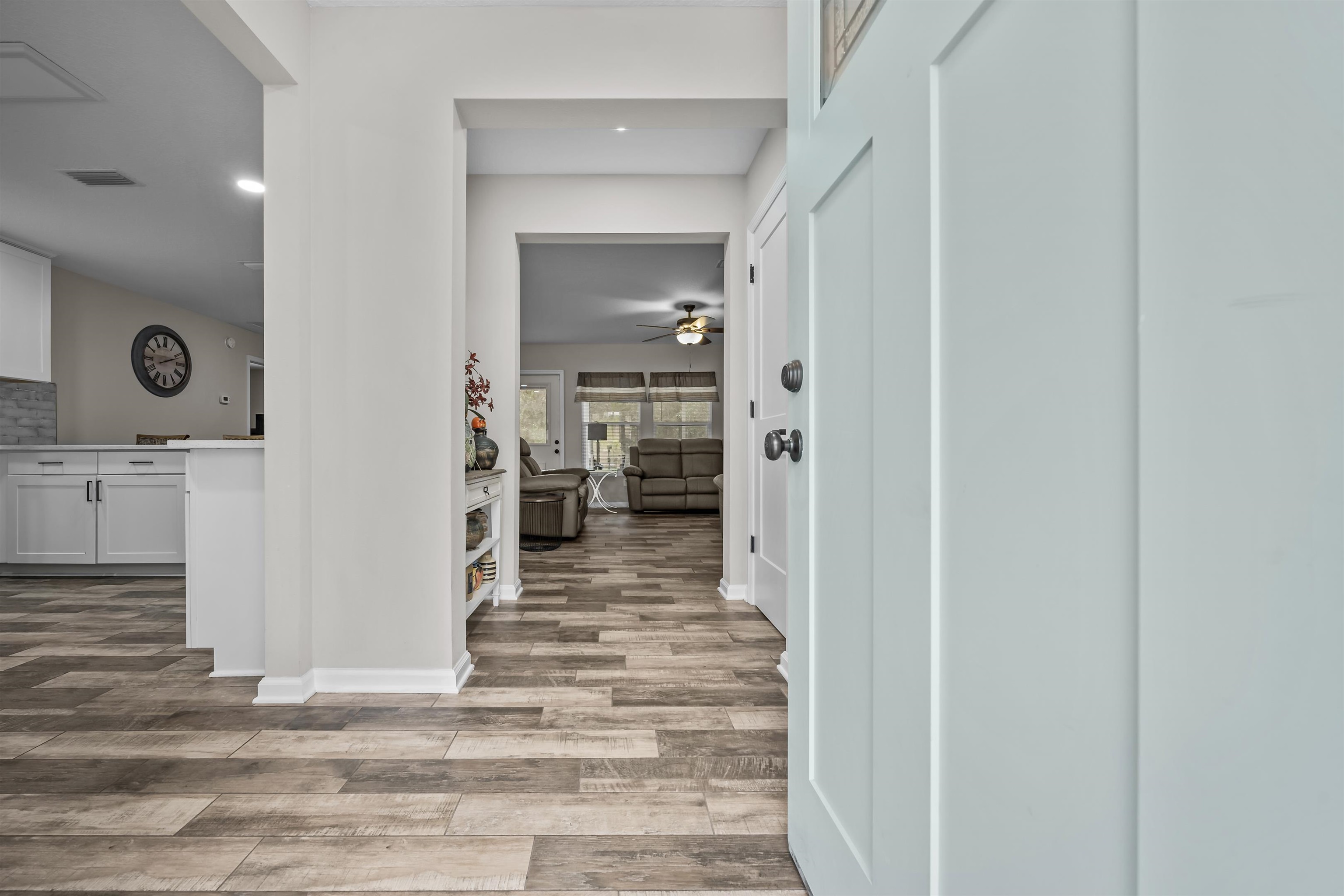 232 Kyte Road San Mateo, FL 32187 - Photo 2 of 36 Hallway with light wood-style floors and baseboards