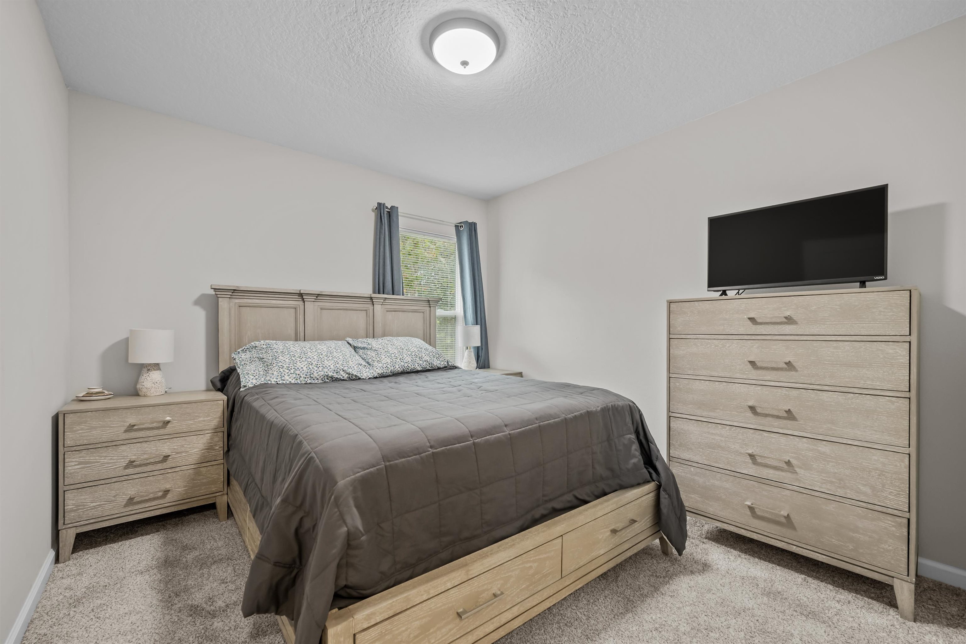 232 Kyte Road San Mateo, FL 32187 - Photo 23 of 36 Carpeted bedroom with a textured ceiling and baseboards