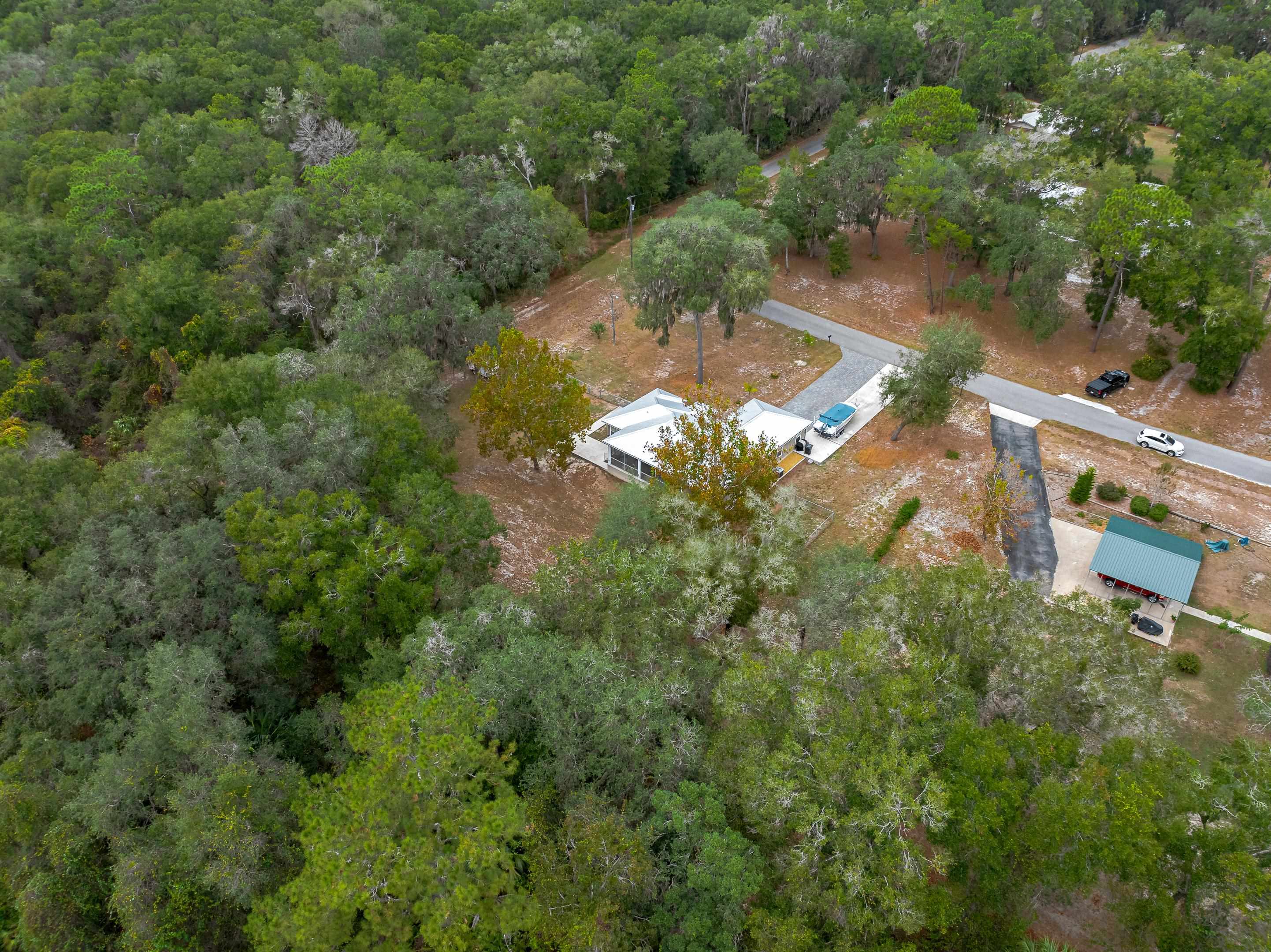 232 Kyte Road San Mateo, FL 32187 - Photo 35 of 36 View of property location with a heavily wooded area