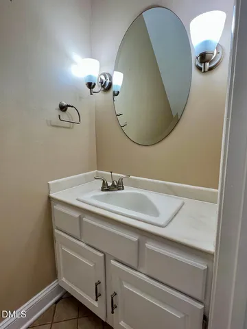 a bathroom with a sink and mirror