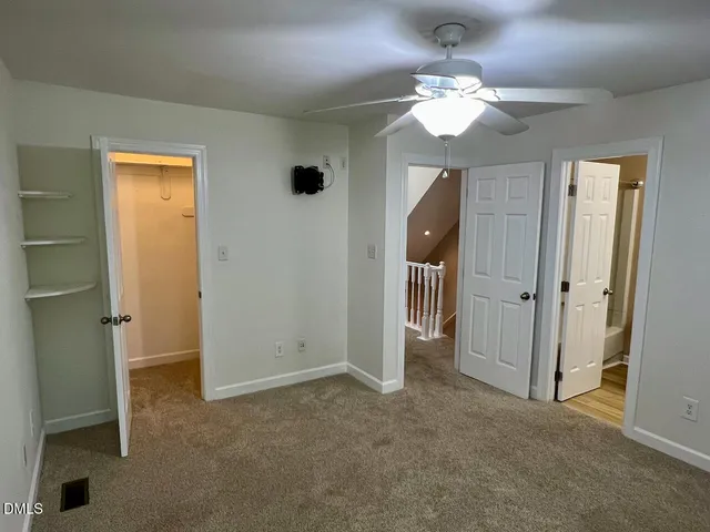 a view of a chandelier in a room with a mirror
