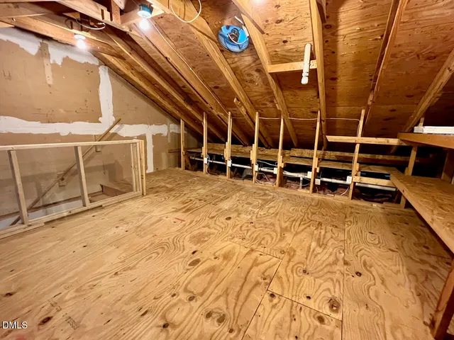 a view of a room with wooden walls