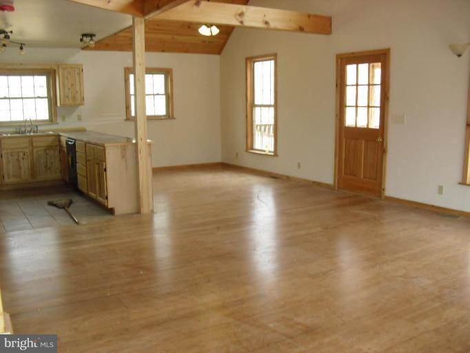 21 Riggs Lane Capon Bridge, WV 26711 - Photo 15 of 24 wooden floor in an empty room with a window