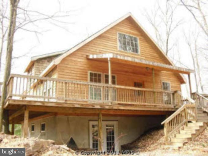 21 Riggs Lane Capon Bridge, WV 26711 - Photo 16 of 24 a house view with a outdoor space