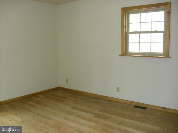 21 Riggs Lane Capon Bridge, WV 26711 - Photo 20 of 24 an empty room with a window